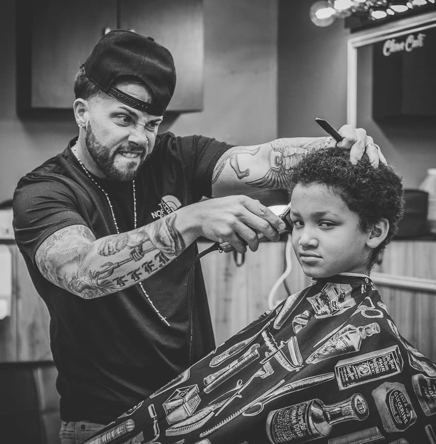 Jeff Danner cutting hair at Clean Cuts