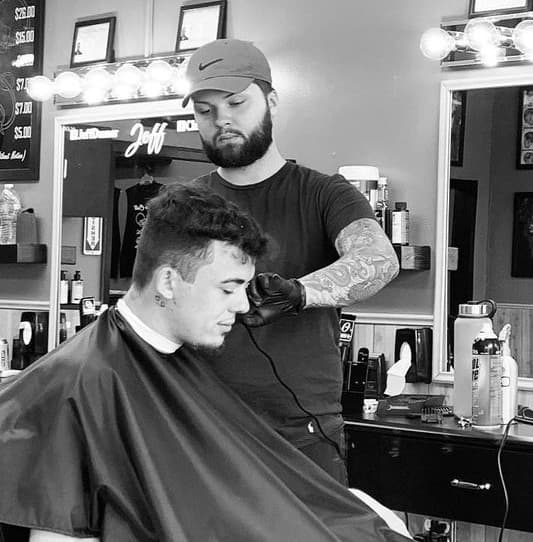 Zack Danner cutting hair at Clean Cuts